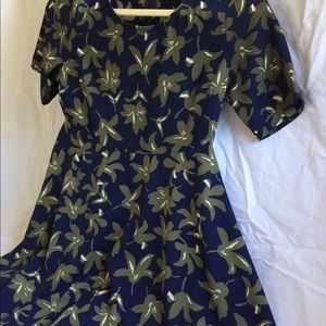 Print navy and sage green empire waist flare dress